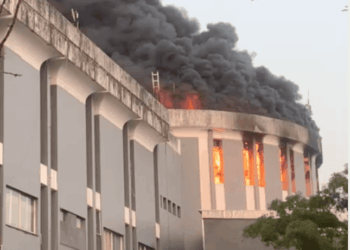 Smoke and flames engulf the Capitol Building during the December fire at the center of the ongoing arson trial in Monrovia.
