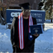 Charles Paul Vah II poses with his MBA diploma after graduating from Concordia University in St. Paul, Minnesota.