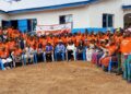 A large group of rural women and officials gather in Todee District during the LWEP engagement event led by Gender Minister Gbemie Horace Kollie