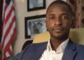 Dr. Clarence Moniba seated in his office, calling on the Legislature to redirect $4.6M from its budget to science laboratory construction across Liberia