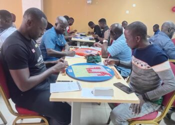 Players seated in a tournament hall during Scrabble Mania 3.0 in Monrovia, Liberia