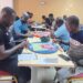 Players seated in a tournament hall during Scrabble Mania 3.0 in Monrovia, Liberia