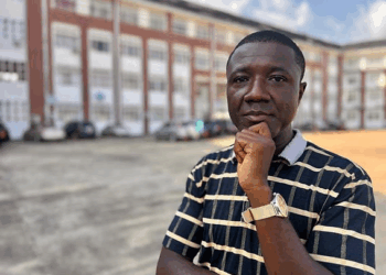 Portrait of Dr. Melvin M. Kollie, newly appointed Chair of the UL Mathematics Department, standing on the Fendall Campus