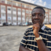 Portrait of Dr. Melvin M. Kollie, newly appointed Chair of the UL Mathematics Department, standing on the Fendall Campus