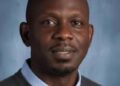 Dr. George Wah Williams, author of the ALT governance reform paper, photographed in a professional portrait setting