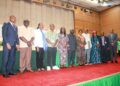 Dignitaries and private-sector leaders standing on stage during the 2025 Liberia MSME Conference where the LIFT Project was formally recognized for its contributions to SME finance and market access