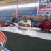 Liberia Basketball Association officials seated at the 2025 policy congress at SKD Gymnasium reviewing documents during the session.