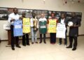 APM Terminals Liberia leaders and Youth and Sports officials pose with County Meet jerseys, trophies, and footballs during the 2025/2026 sponsorship handover ceremony.
