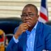 Former LTA Chair Abdullai Kamara seated in a courtroom setting during legal proceedings, appearing thoughtful as corruption charges against him advance to Buchanan