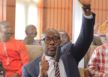 Senator Amara Konneh raises his hand during a legislative session as he questions the legality of FY2026 budget transfers and calls for stronger Senate oversight.