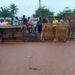 Residents of Suakoko District block the Gbarnga–Monrovia Highway with wooden barricades during a protest demanding justice for the death of Quita Jackson.