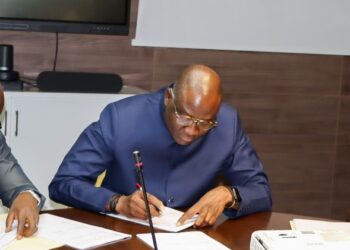 Central Bank of Liberia officials and executives from MTN Mobile Money and Orange Money signing participation agreements to enhance Liberia’s Instant Payment System.