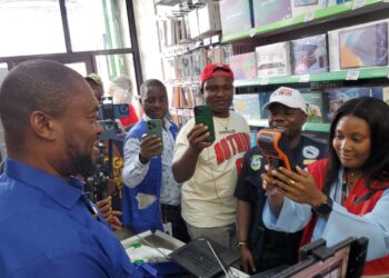 CSA Director-General Dr. Josiah F. Joekai Jr. demonstrating the new digital LPA biometric platform during a live transaction in Monrovia.