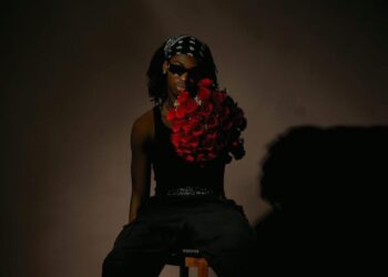 Liberian R&B and Afro-soul artist Jadeo holding red roses during a studio photoshoot for his single Bad Way.