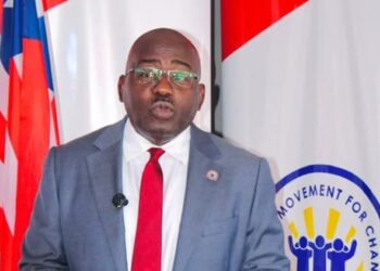 CMC leader Musa H. Bility speaks at a podium as he promotes proposed legislation to help African-Americans make Liberia a second home.