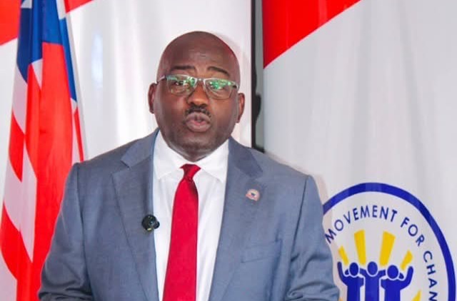 CMC leader Musa H. Bility speaks at a podium as he promotes proposed legislation to help African-Americans make Liberia a second home.