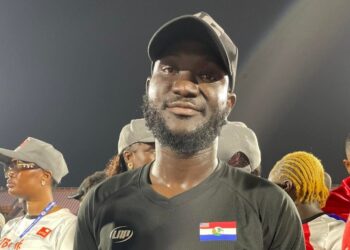 Nimba County coach Mamadee “Benzema” Sheriff speaks to supporters after leading Nimba to its seventh County Sports Meet championship.