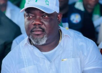 Deputy Speaker Thomas P. Fallah wearing a white cap during a public political event in Liberia
