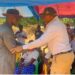 Quanuquanei Alfred Karmue and Guinean officials greet each other during a cross-border development ceremony near the Nié River.