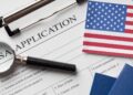 U.S. visa application form and passport as reported processing freeze affects Liberia and other countries