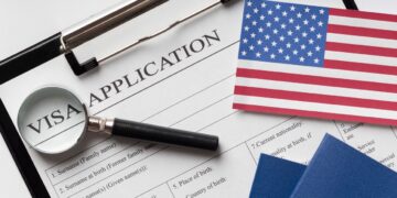 U.S. visa application form and passport as reported processing freeze affects Liberia and other countries