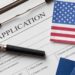 U.S. visa application form and passport as reported processing freeze affects Liberia and other countries