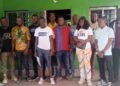 Participants pose during a Liberia Forest Media Watch forum in Monrovia focused on forest accountability and enforcement against illegal activities.