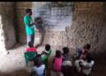 A deteriorating public school building and pupils studying in an unfinished classroom in Todee District, Montserrado County.