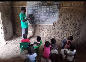 A deteriorating public school building and pupils studying in an unfinished classroom in Todee District, Montserrado County.