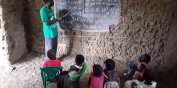A deteriorating public school building and pupils studying in an unfinished classroom in Todee District, Montserrado County.