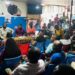 Audience gathered in a crowded room listening to a speaker at a Naymote public forum discussion on governance and accountability in Monrovia
