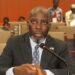 Representative Jeremiah G. Sokan speaking into a microphone during a legislative session at Liberia’s House of Representatives
