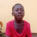 Visually impaired teen Henry Joe in a red shirt speaking in Gbartala, Bong County, as he appeals for support to return to school.