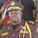 Liberia Immigration Service officer in uniform during a regional meeting in Bomi County where LIS announced plans to build rural housing for officers in western Liberia.