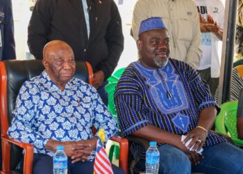 Musa Hassan Bility with senior political figures during public event in Monrovia