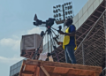 Camera operator films live sports broadcast for Intel Sports in Liberia