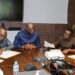Officials of the Central Bank of Liberia review documents during a meeting on mobile money regulation and the rollout of the Inclusive Instant Payments System in Monrovia.