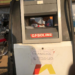 Gasoline pump in Paynesville showing reduced fuel price as transport fares remain high.