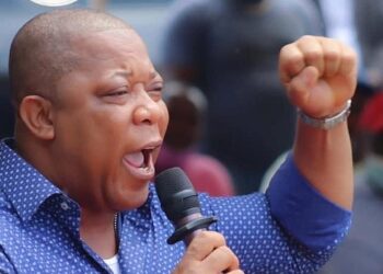 Mulbah Morlu addresses supporters as Liberia police file charges over protest