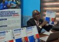 Naymote Executive Director Eddie Jarwolo presents President Meter Report on ARREST Agenda progress