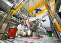 Technicians assemble a liquid oxygen-methane rocket engine at LandSpace as China expands commercial spaceflight