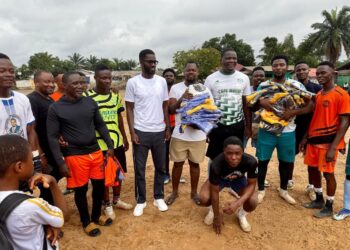 Alioune Badara Kebe with young athletes during a youth sports development program in Liberia