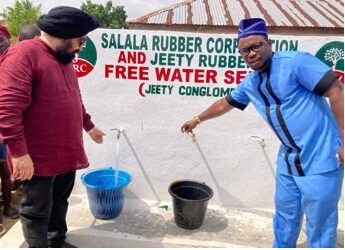 Jeety Rubber and Salala Rubber Corporation officials, including Margibi Superintendent O. Jay Morris, test a newly dedicated free borehole tap providing clean drinking water in Weala, Margibi County.