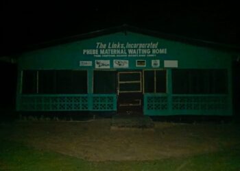 Phebe Maternal Waiting Home in Suakoko District, Bong County, pictured at night without electricity as pregnant women face years of neglect.
