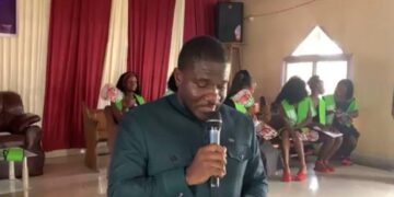 Siaffa Bahn Kemokai delivers the keynote address during the Innovative Vocational Institute’s first graduation ceremony celebrating women’s skills training in Monrovia.
