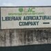 Signboard of the Liberian Agricultural Company (LAC) at the entrance to its concession area in Grand Bassa County, Liberia.