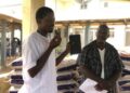 Diaspora representatives distribute rice rations to volunteer health workers at James Jenkins Dossen Memorial Hospital in Harper