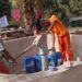 inmates fetching water at the community water pump