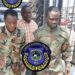 Liberia National Police escort suspects accused of posing as AFL soldiers