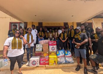 Members of Noble Second Floor present donated supplies to the National Palace of Corrections in Zwedru